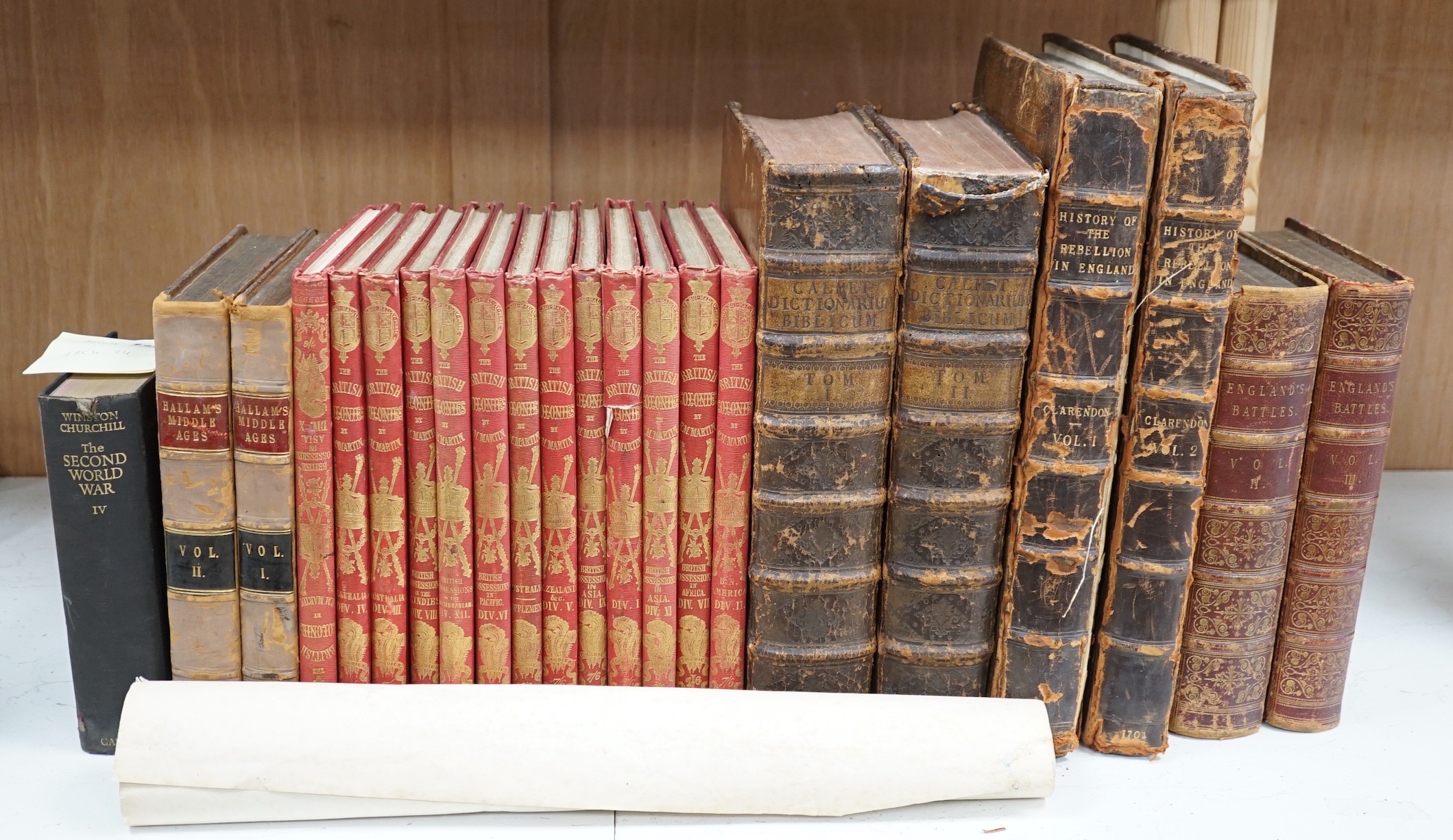 A quantity of leather and cloth bound books and a poster